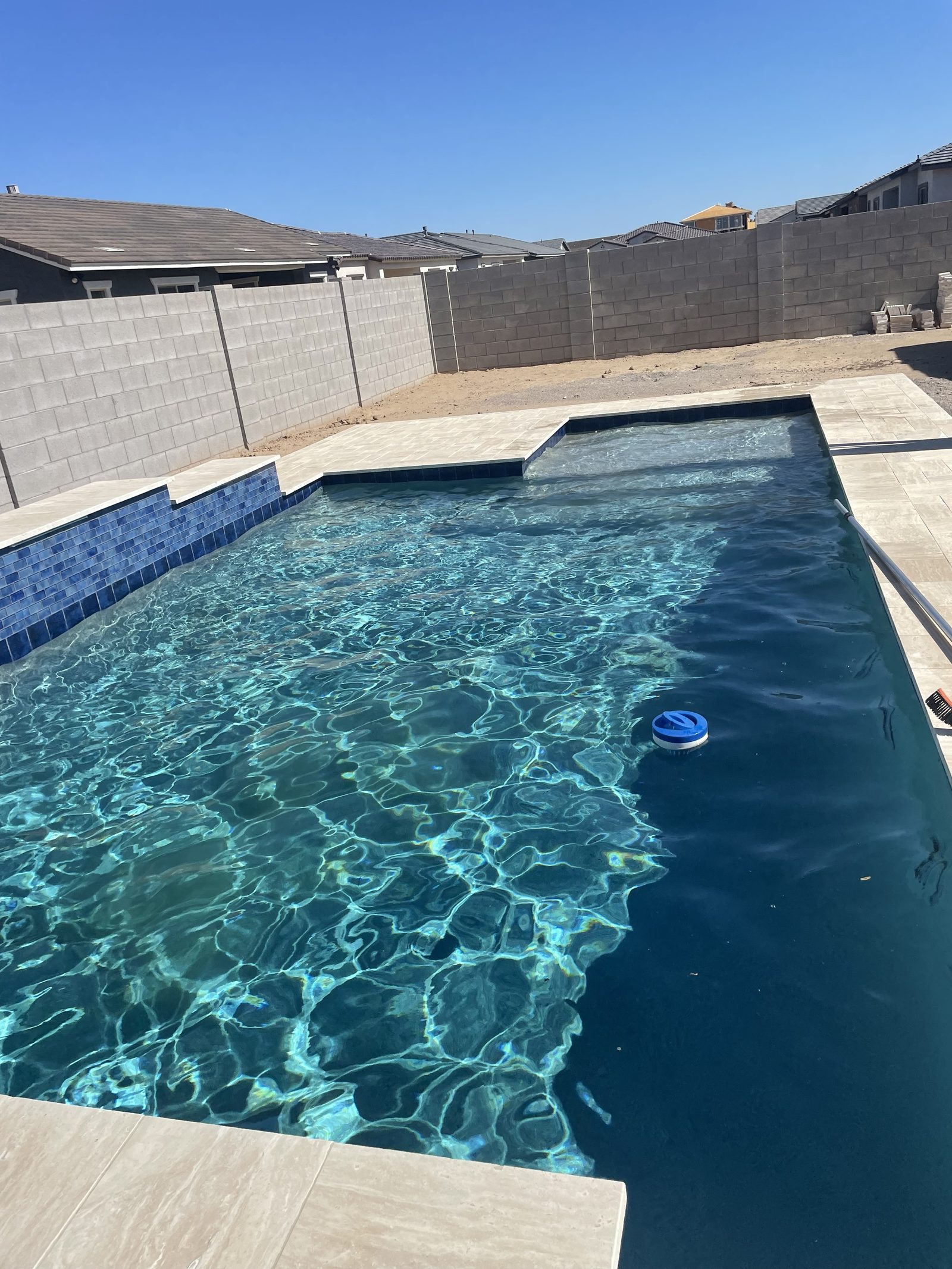 New pool with blue tile built by Arizona Pool Service